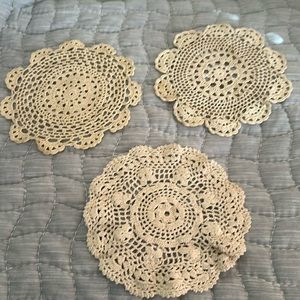 Three crocheted vintage look doilies.